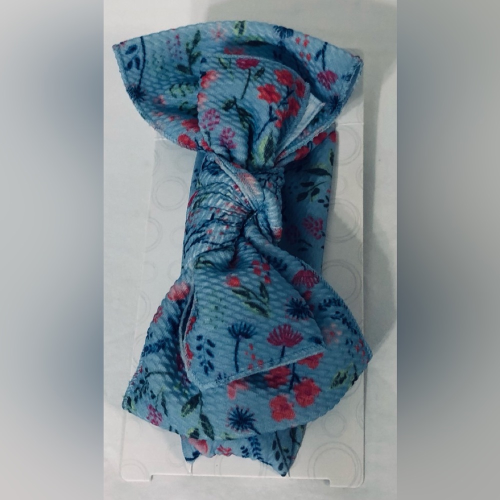 Girl’s head wrap with giant bow blue floral. Age 3up